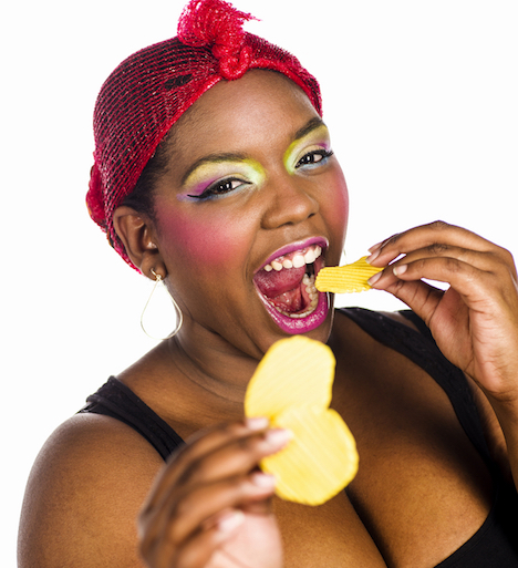 Shutterstock.com/Woman eating chips