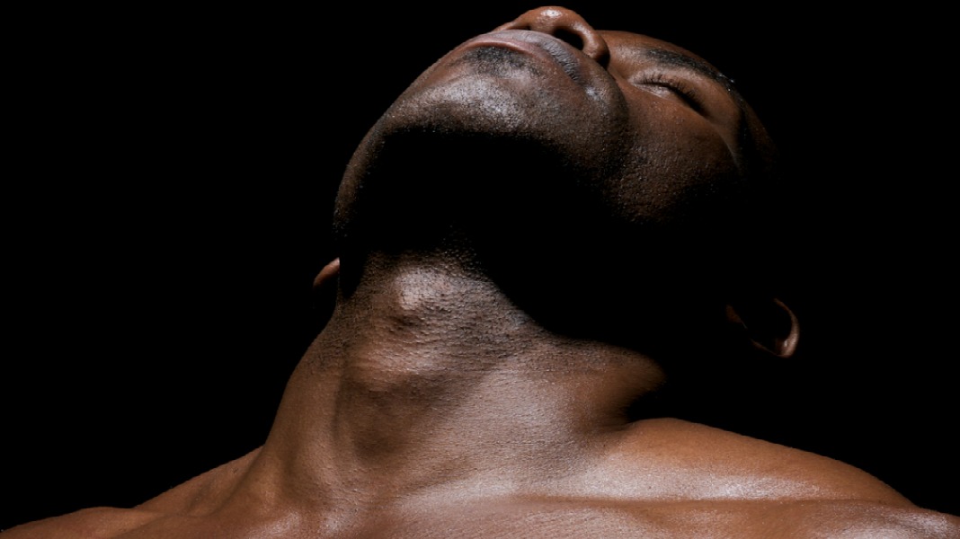 Close up of worked pectorals of an African American Young. 