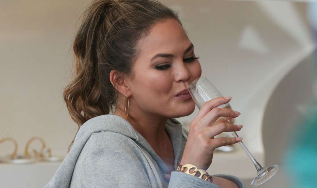 Chrissy Teigen drinking