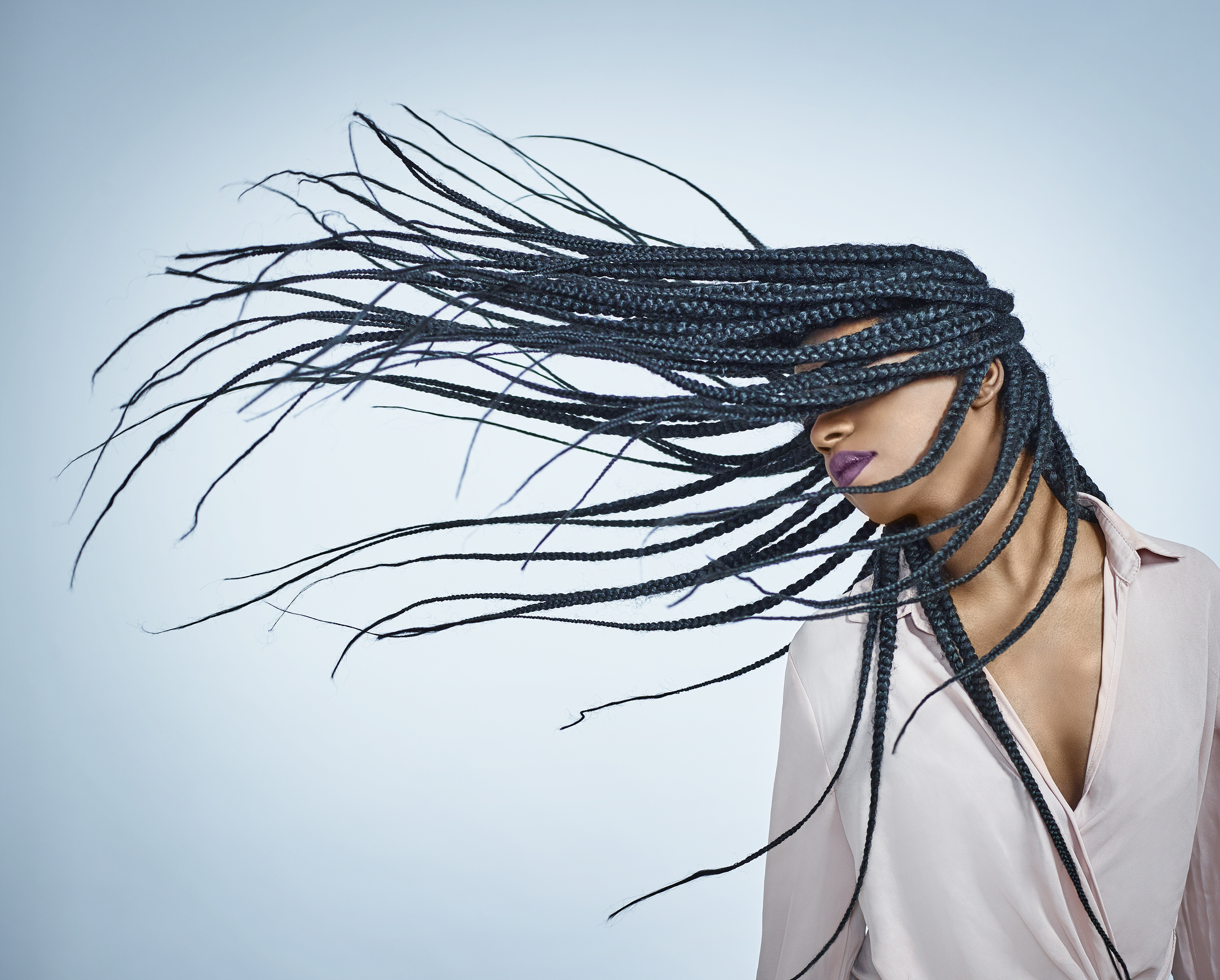 Black female flicking hair