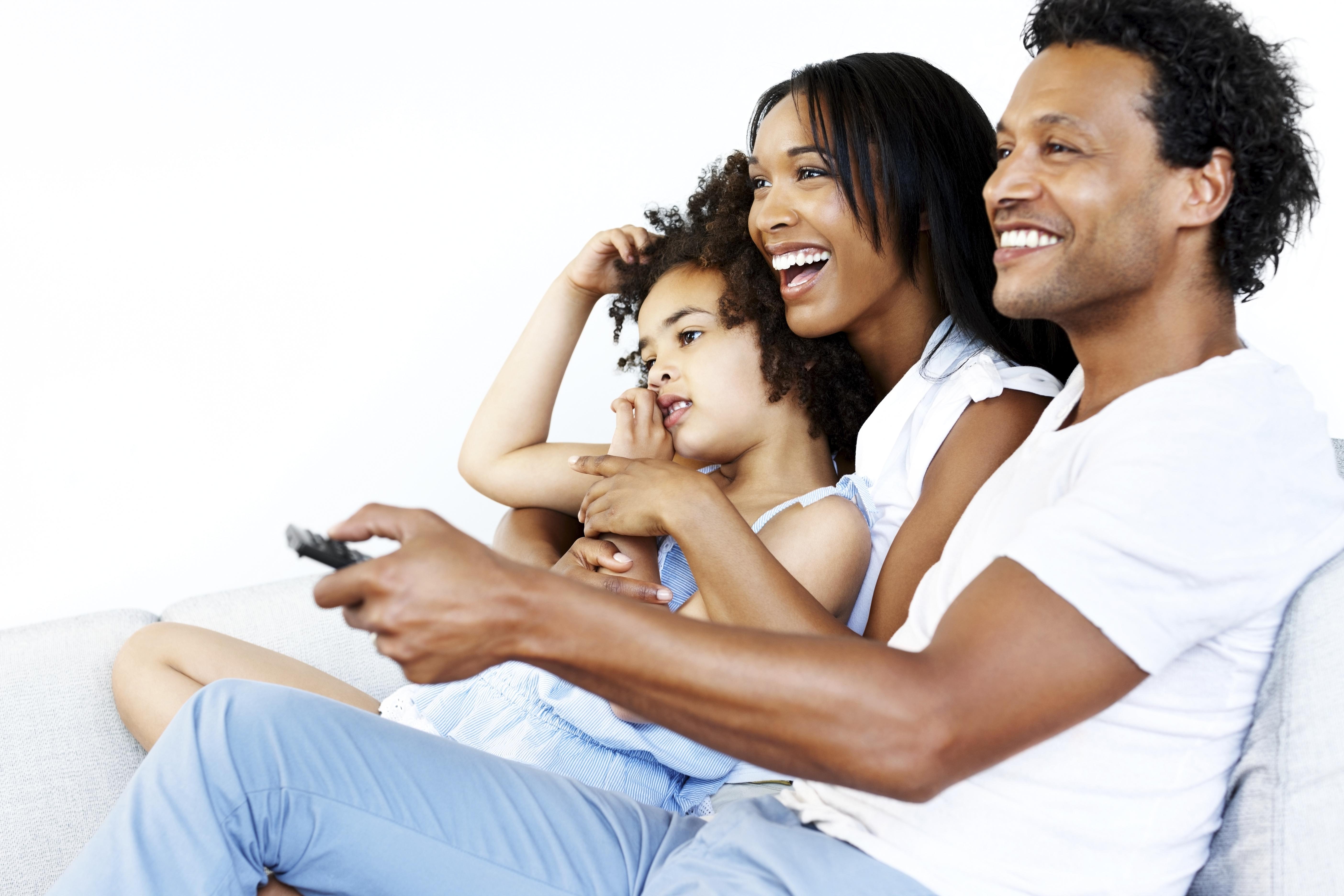 Beautiful young family watching TV