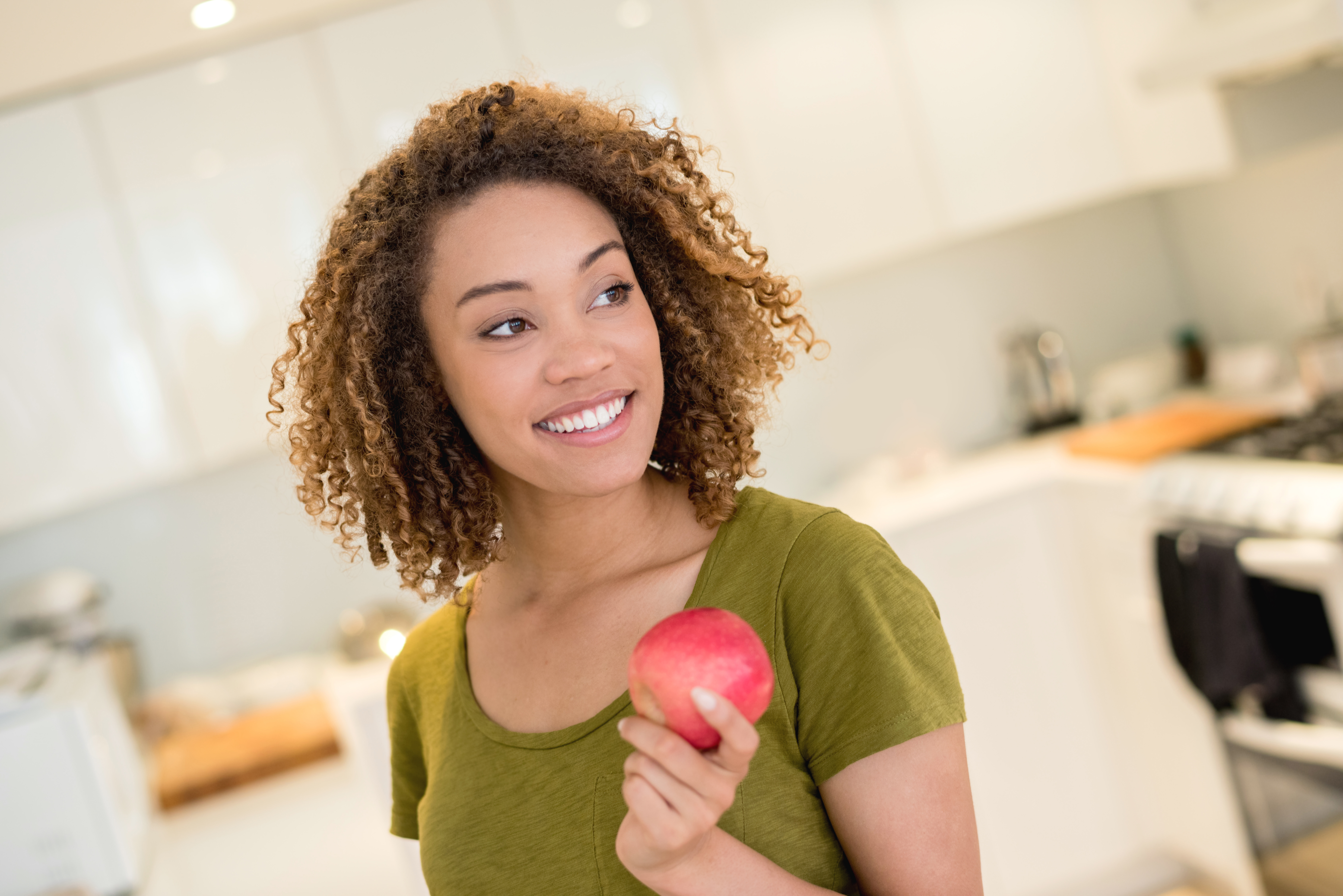 Healthy eating woman holding an apple