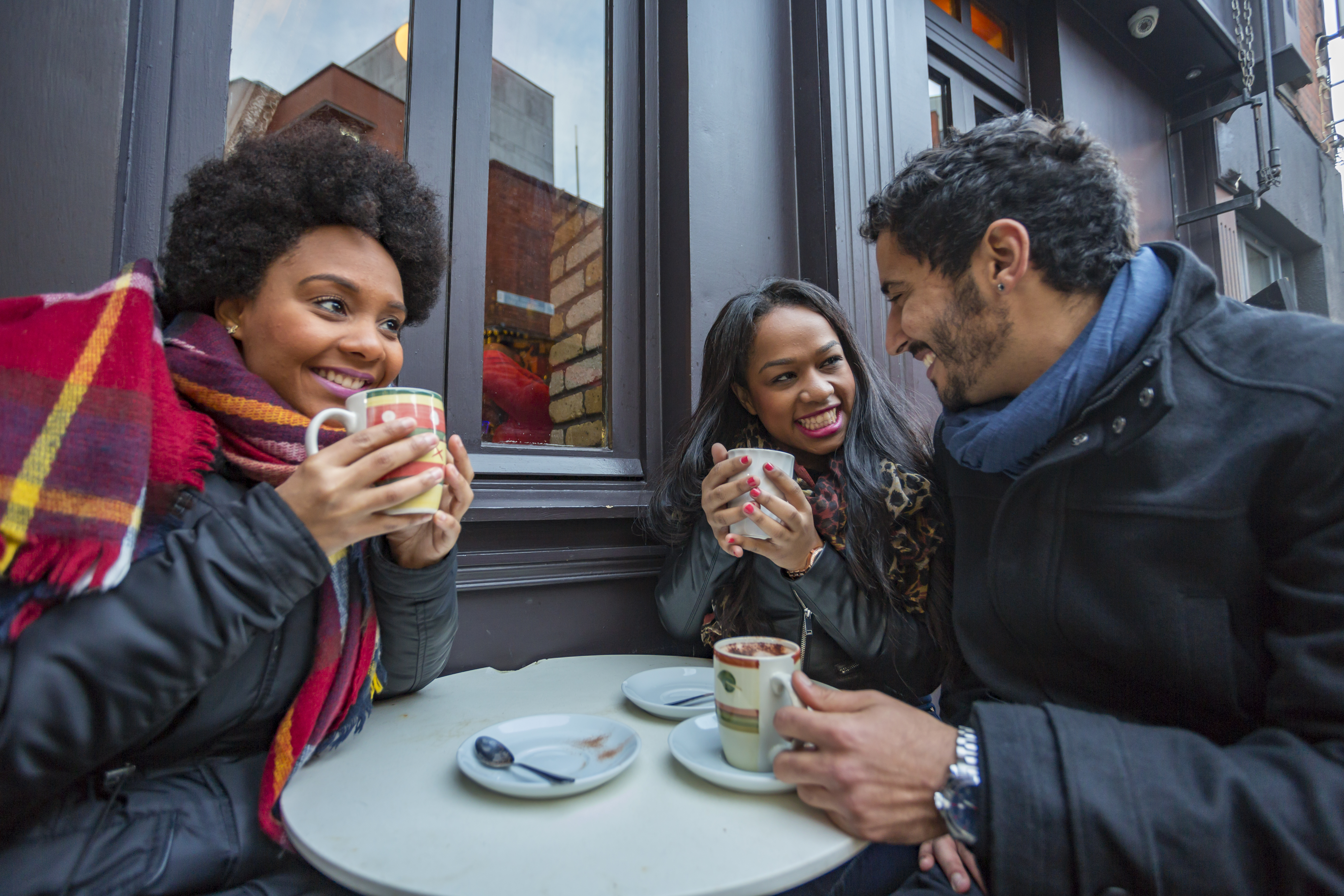 Young Friends Having Fun at a Cafe