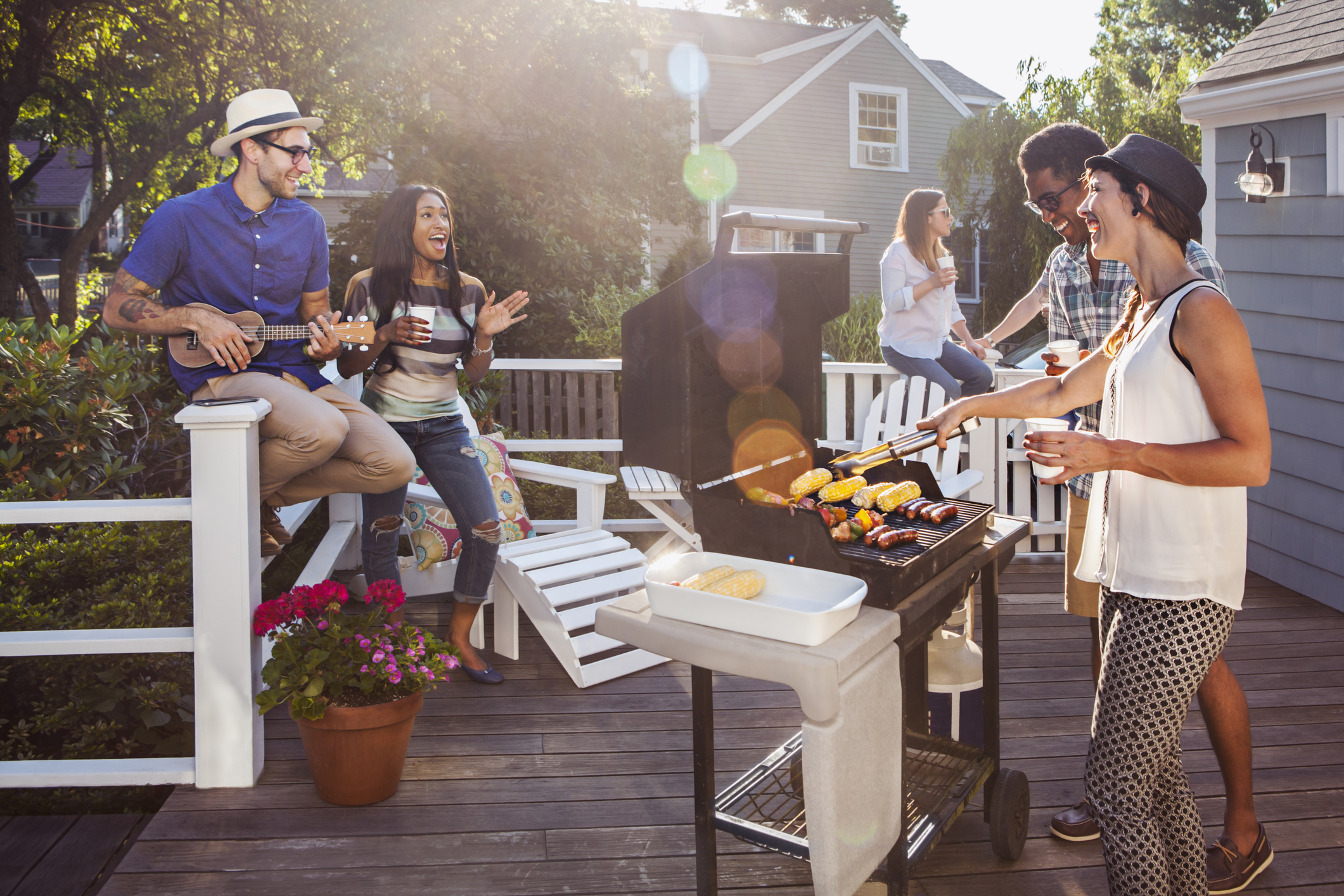 Friends enjoying barbecue on patio