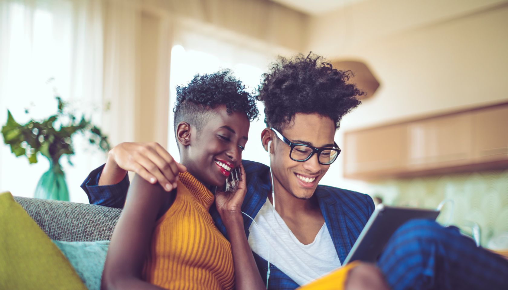 Young couple is listening music at home