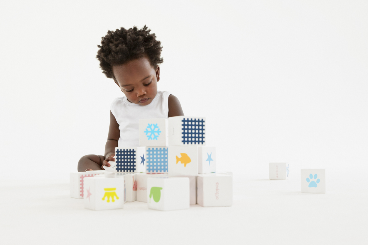 Baby playing with wooden blocks