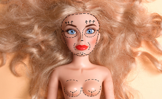 Doll marked up for plastic surgery
