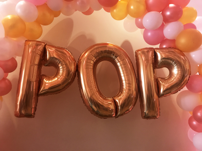 Balloons that spell 'POP'