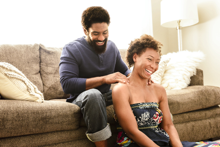 Man giving woman a massage