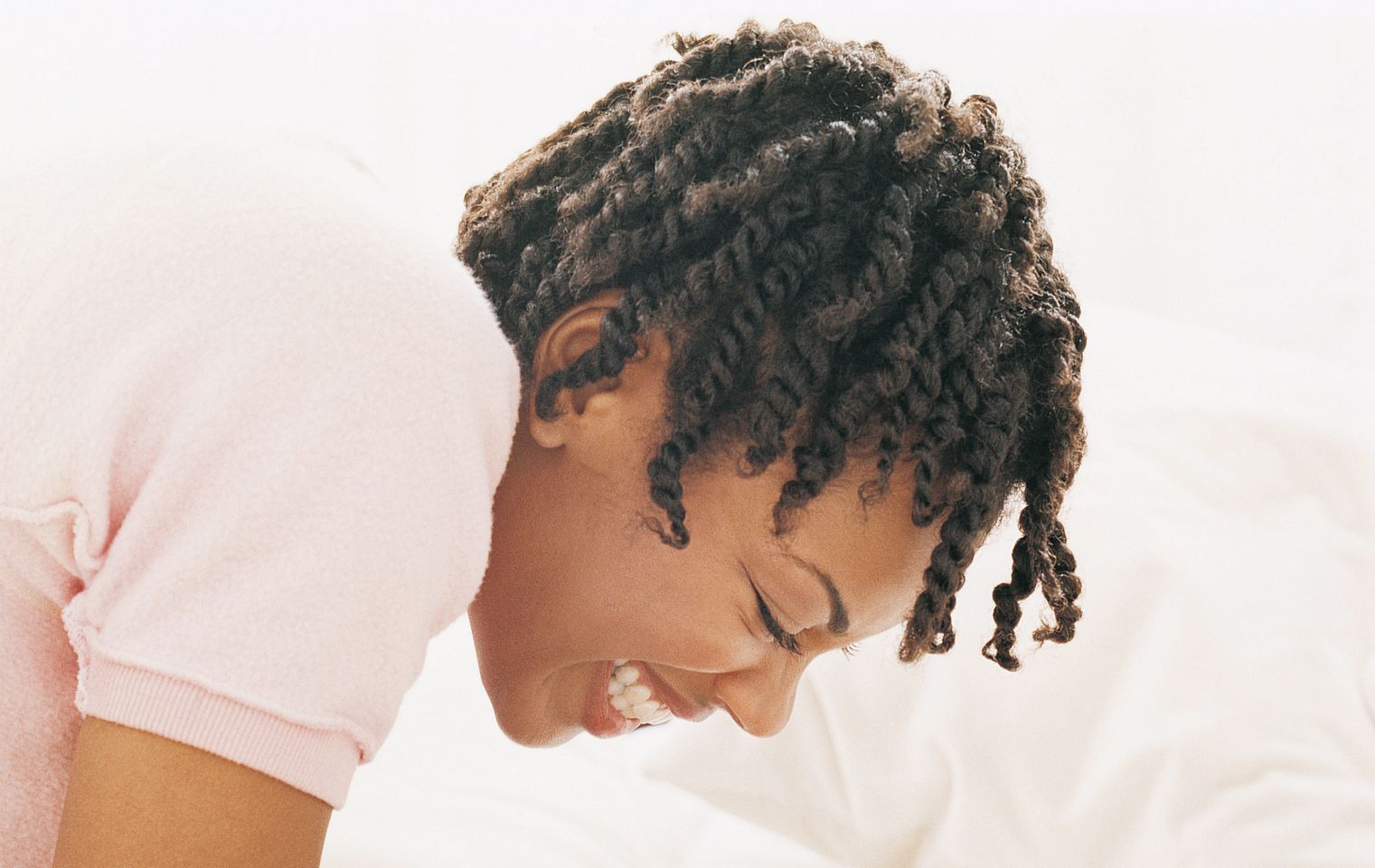Couple Playing in a Bedroom, Woman Holding Man's Nose
