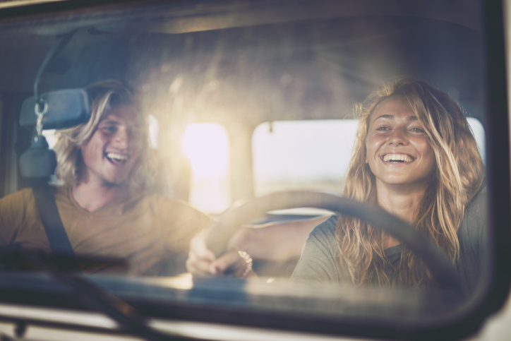 Young happy couple enjoying in road trip.
