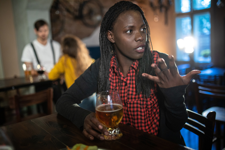 African woman at pub