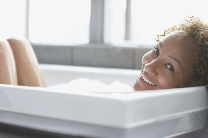 Woman in bathtub smiling