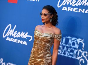 Tami Roman in a gold dress on theBET Presents: 2018 Soul Train Awards Red Carpet