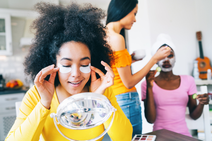 Girls taking good care of their skin and making mask