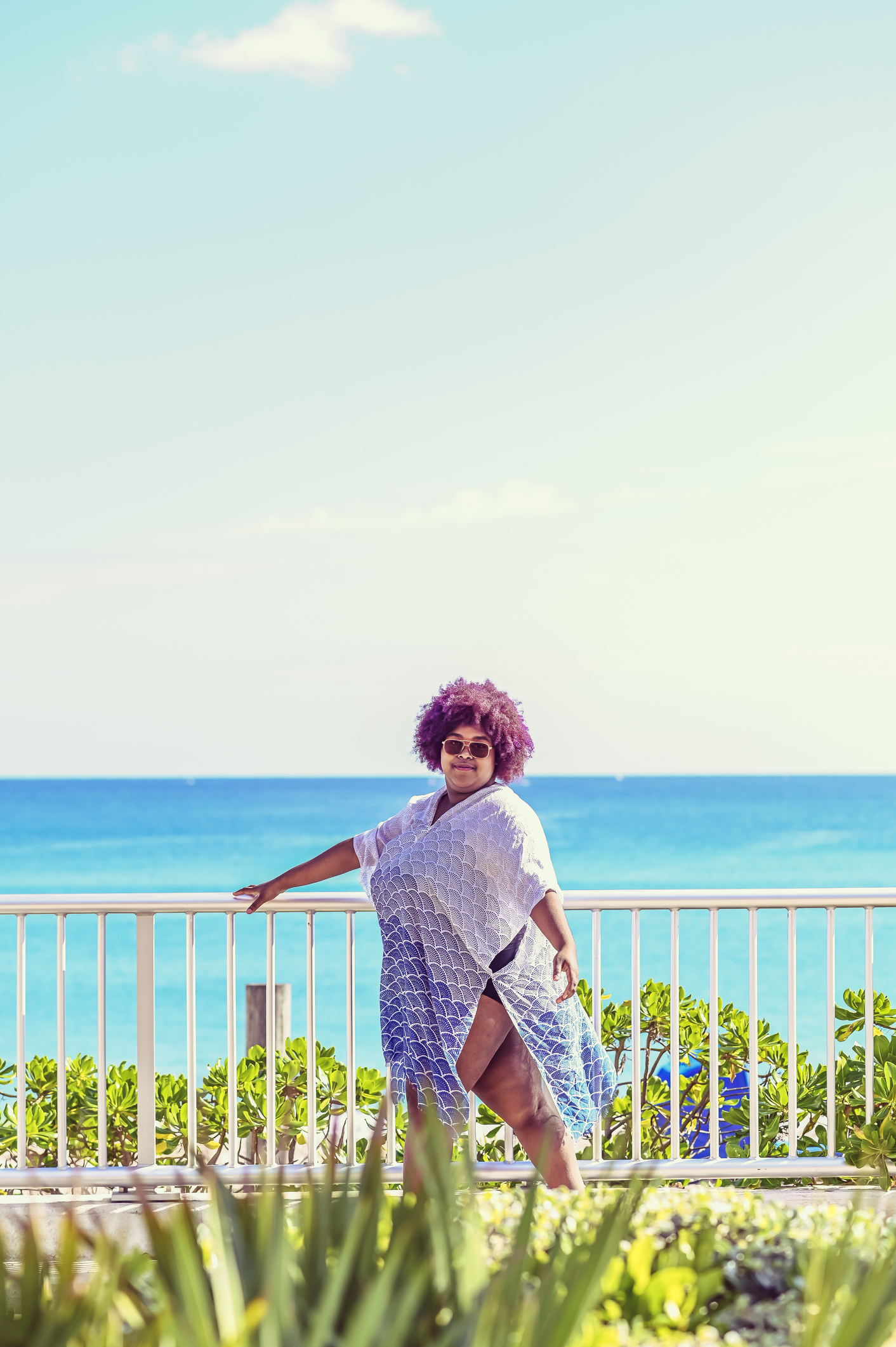Plus size African American Woman in Paradise, beautiful costal day at the beach