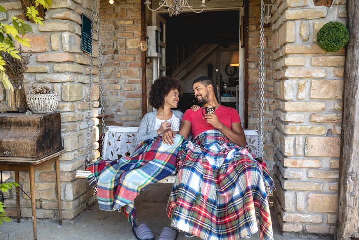 Serene couple spending leisure time on a porch swing