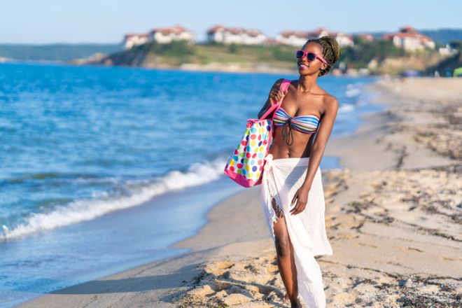 African woman walking on the beach