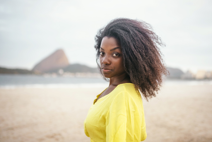 young afro-brazilian woman at beach in Rio