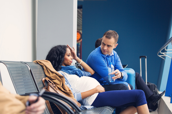 Pregnant woman traveling by plane