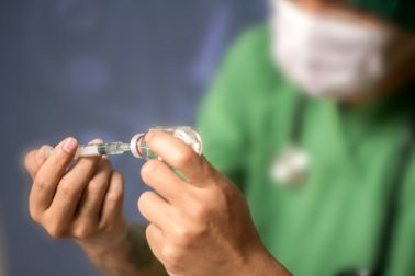 Doctor hold syringe prepare for injection,Epidural analgesia,Epidural nerve block, spinal block,Health care concept.