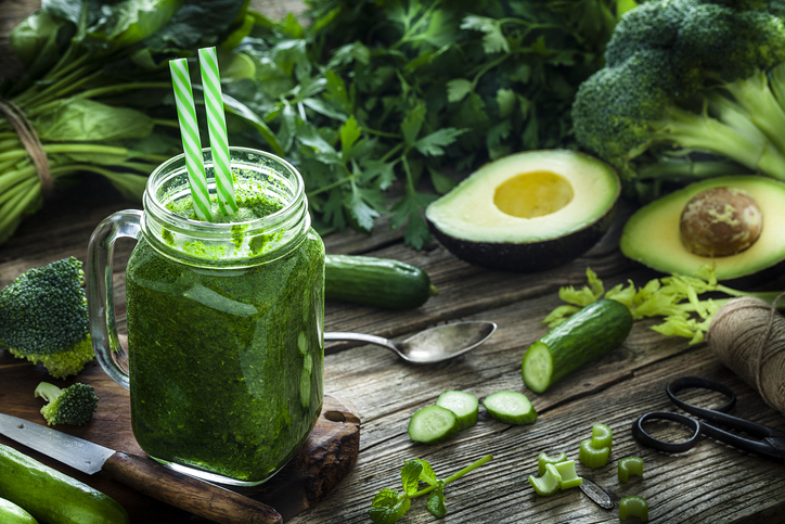 Healthy drink: green vegetables juice on rustic wooden table