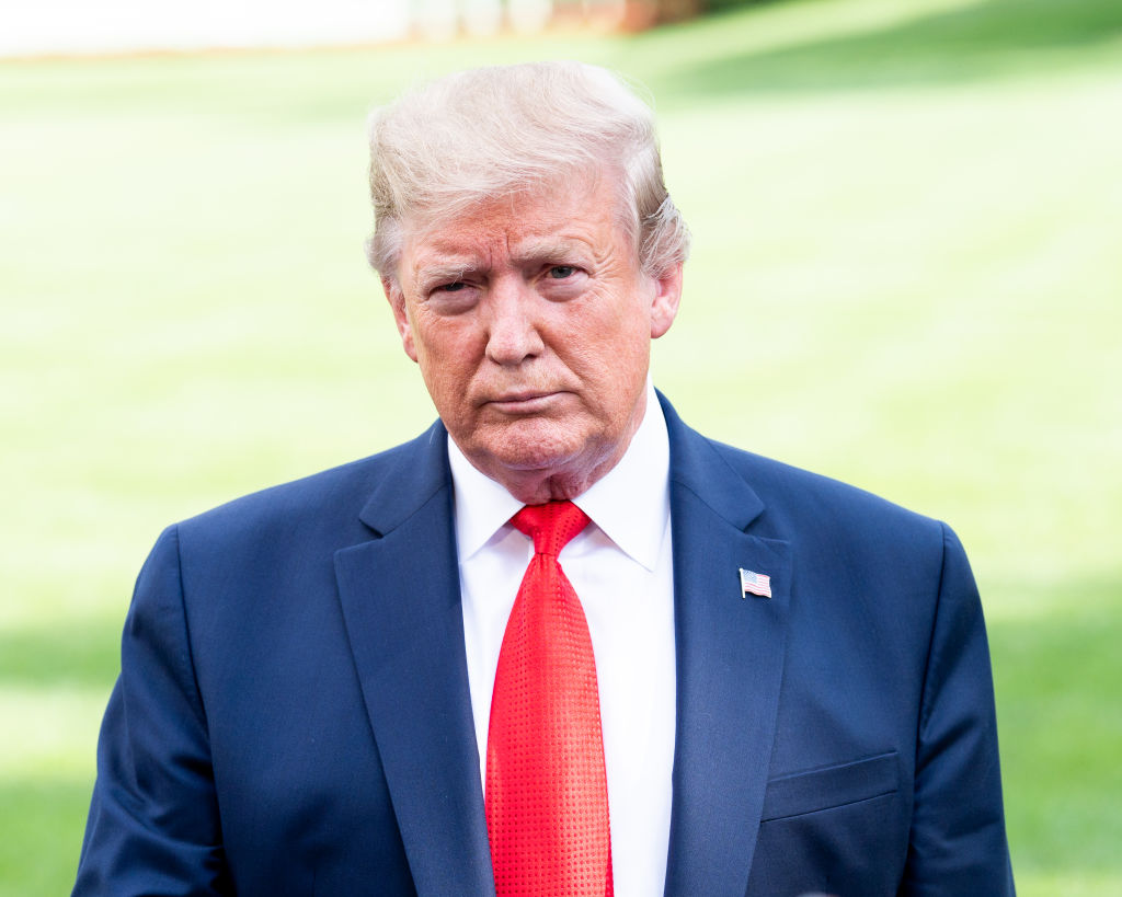 President Donald Trump talking with the press as he leaves...