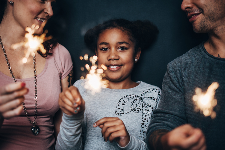 Modern cute family with sparklers