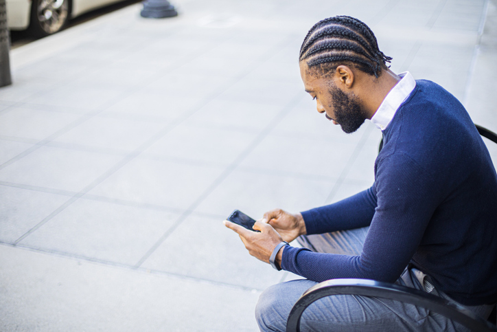 Attractive Young Businessman Sitting