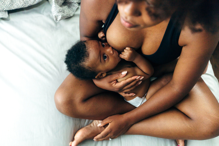 Black mom breastfeeding baby