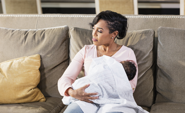 African-American mother nursing baby boy