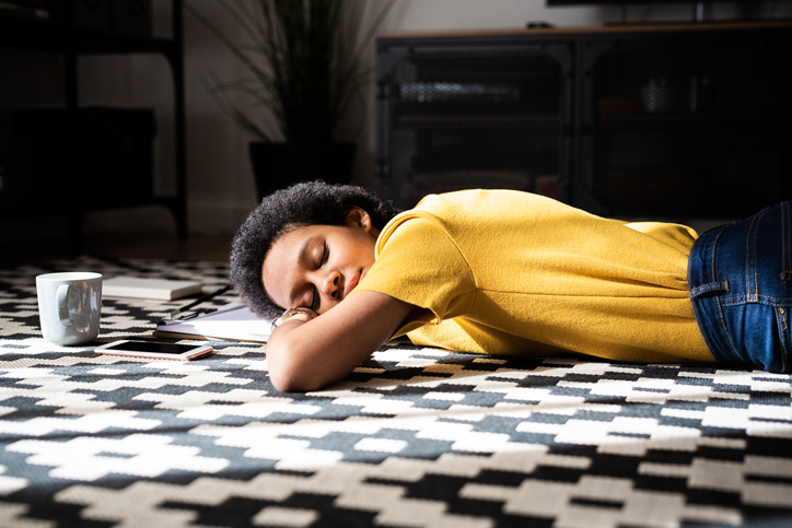 Young woman relaxing on the floor at home