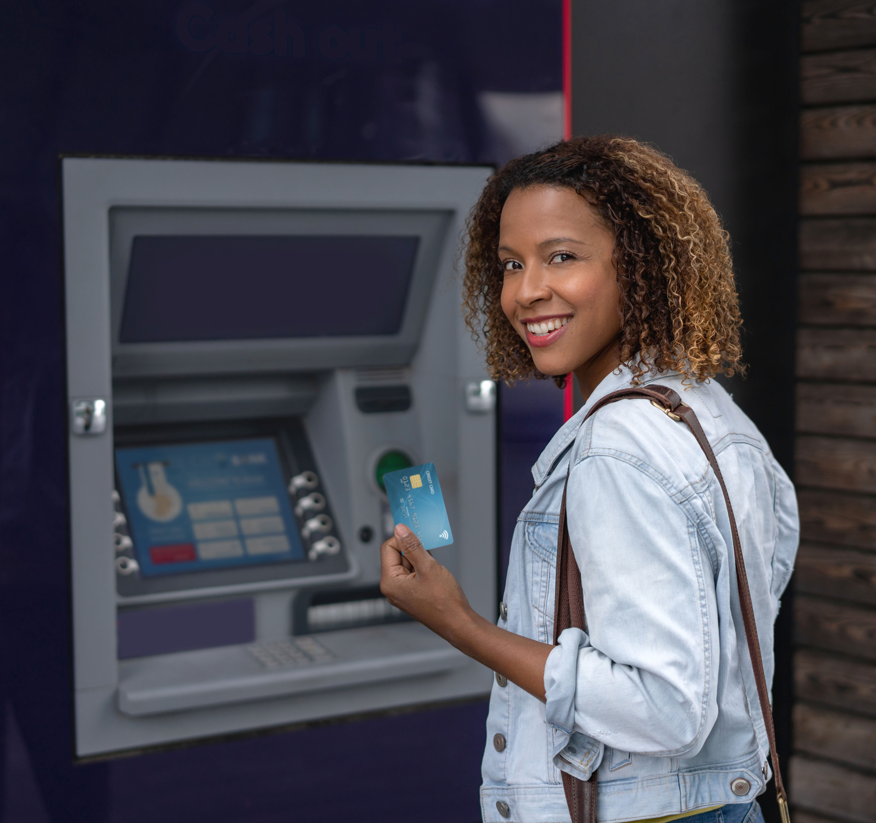 Woman withdrawing money from an ATM