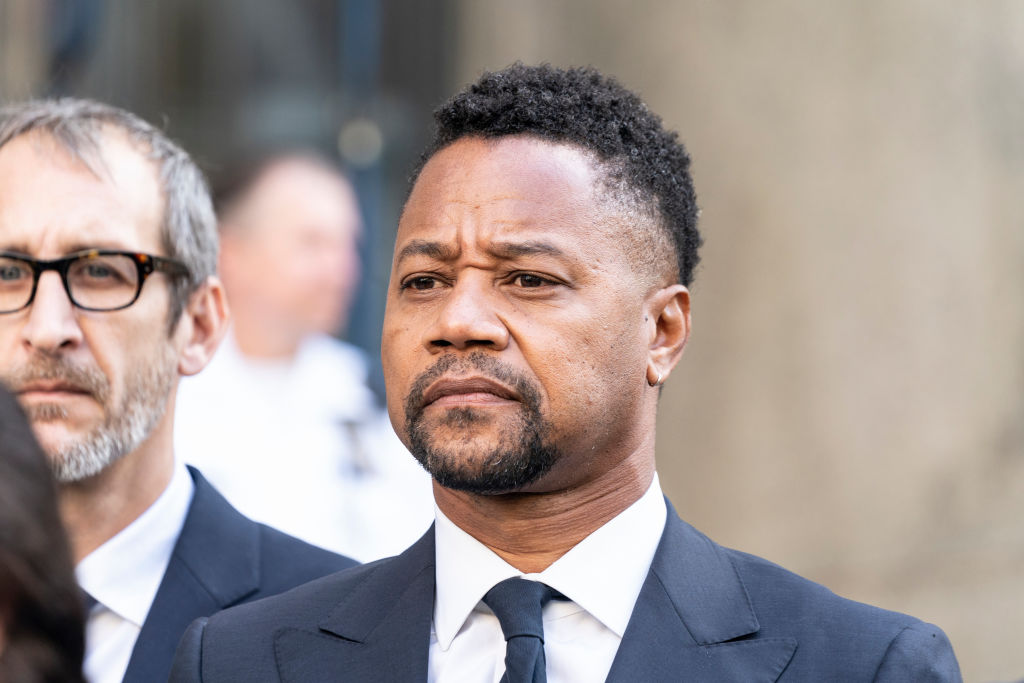 Actor Cuba Gooding Jr. listens as attorney Mark Heller...