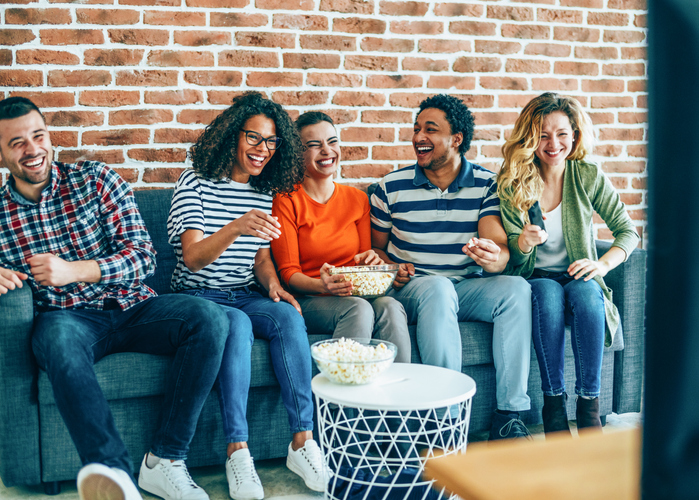 Group of friends watching tv