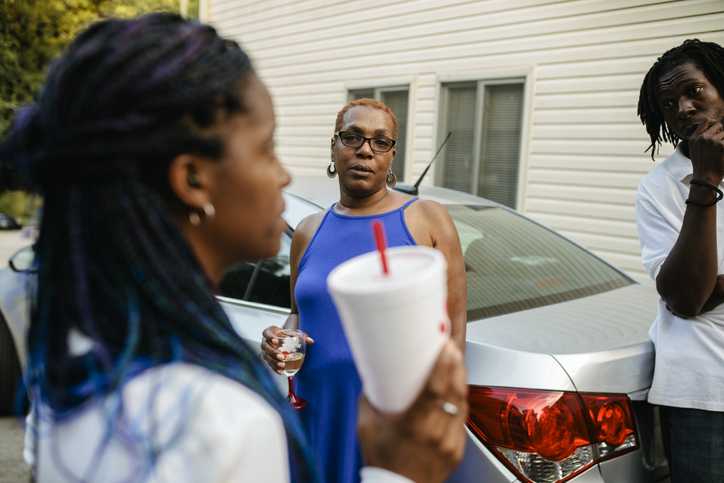 Black family members socializing together