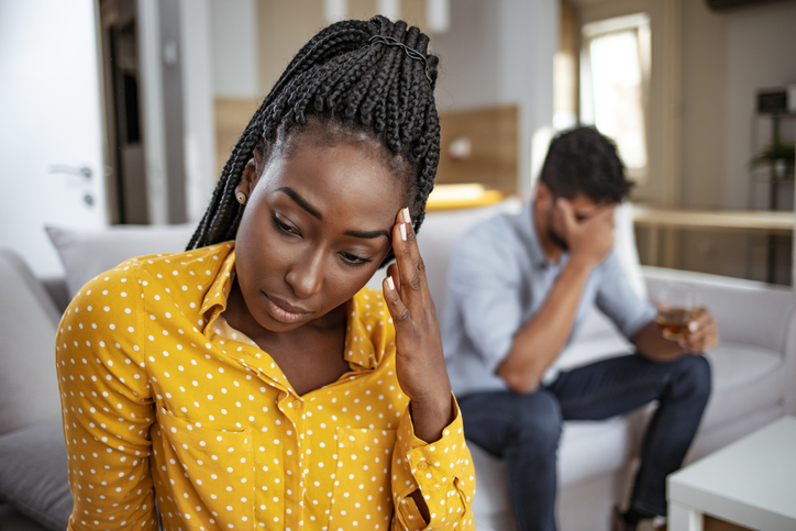 Black woman and man after quarrel at home