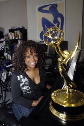 Katreese Barnes sits at the piano in her E. 90th St. apartme