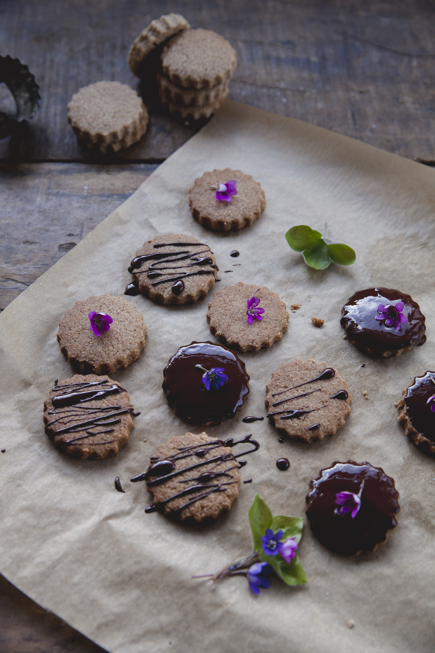 Homemade cookies decorated with chocolate and spring flowers