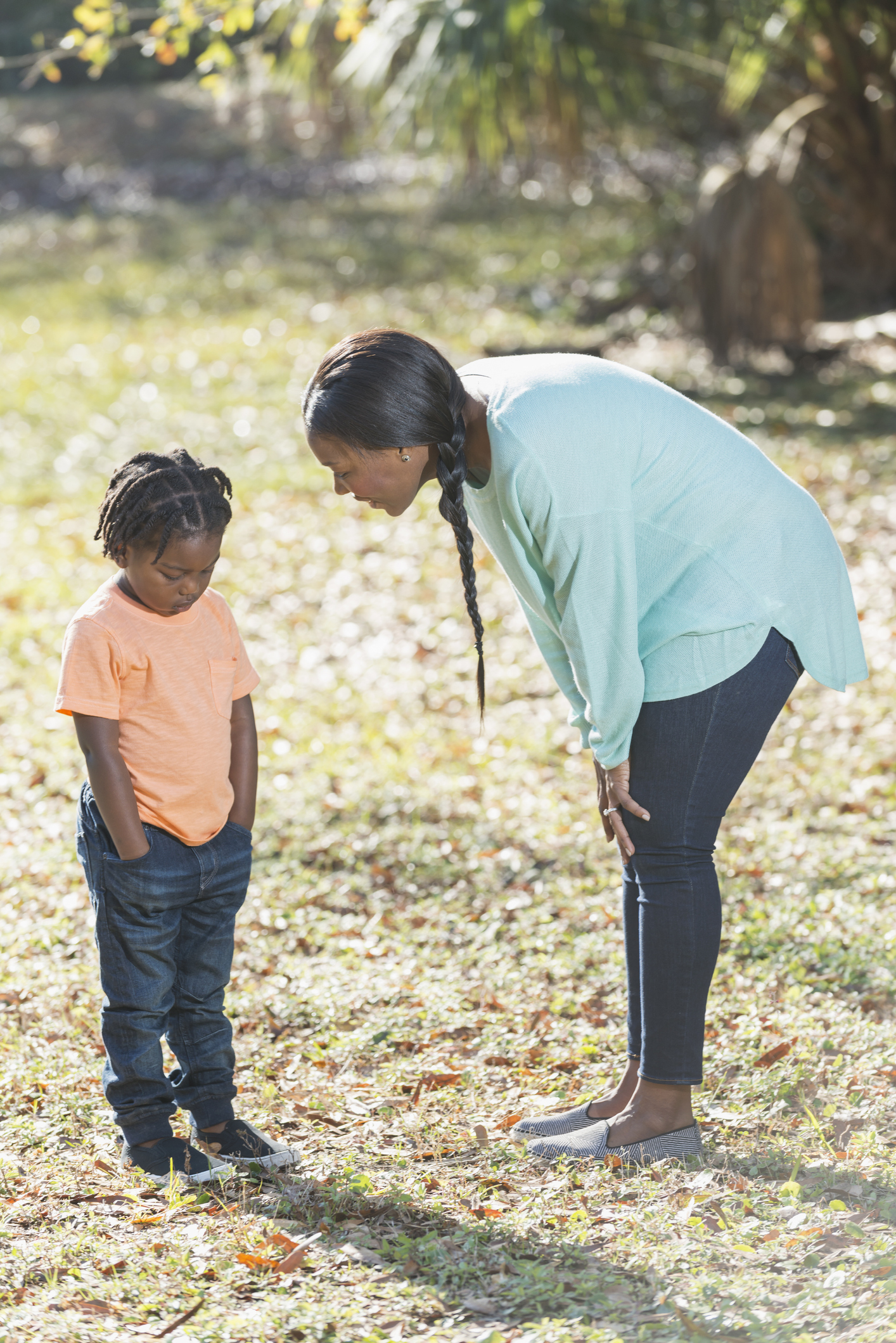 Little boy in trouble, mom scolding