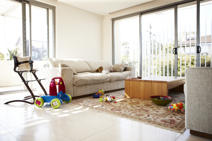 Empty lounge room with scattered toys
