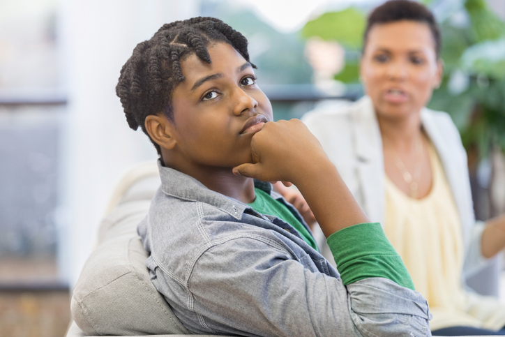 Teenage boy ignores lecturing mother at home