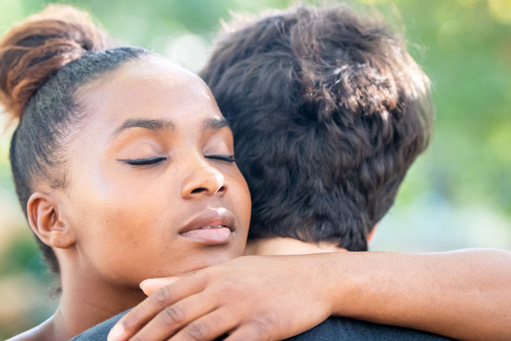 Young diverse couple embracing