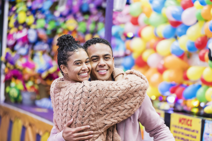 Young African-American couple playing carnival game