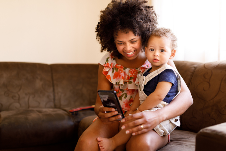 Mom and baby using cell phone