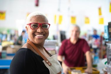 Portrait of smiling mature cashier at wholesale