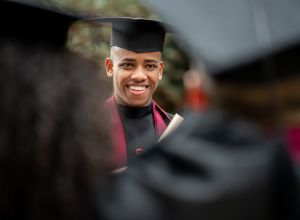 African American student looking happy on his graduation day