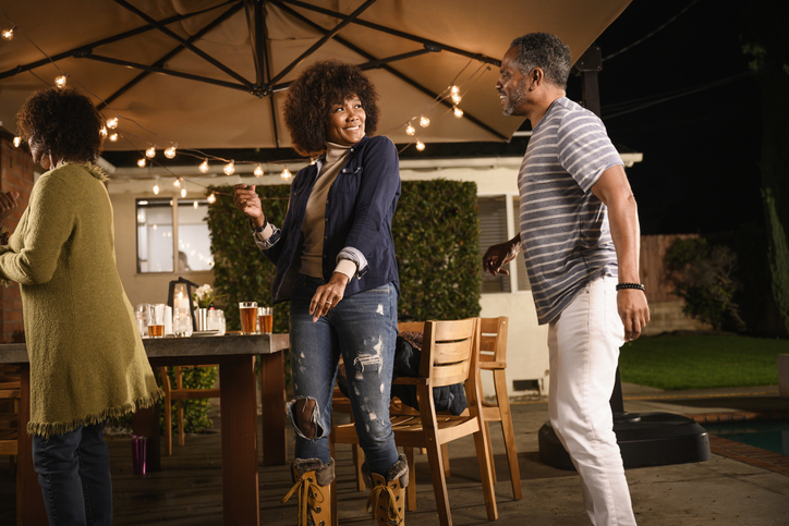 Mature couple dancing at outdoor party