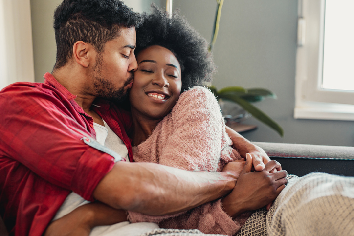 Portrait of couple relaxing at home