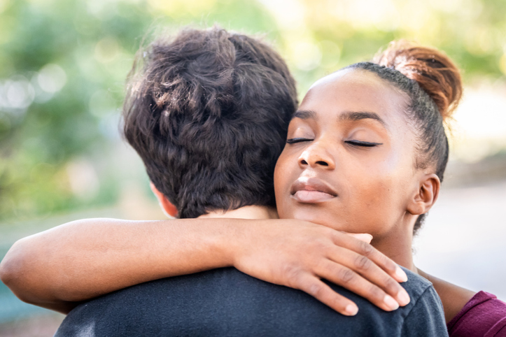 Diverse young couple, they are embracing